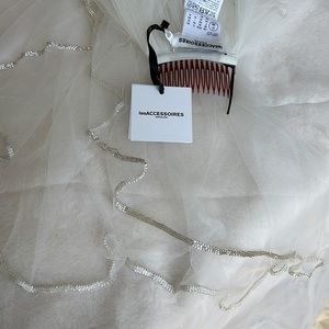 Pronovias 2 tier circle veil glass beads.